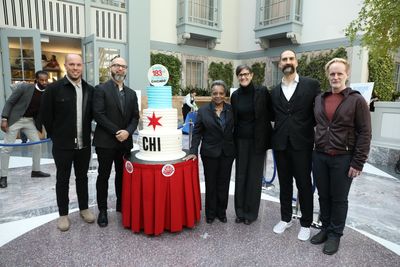 Mayor Lightfoot, First Lady Eshelman, Design Director Jason Kunesh, Designer Patric King, Executive Design Director Gabe Usadel, and Designer Steve surround a happy birthday Chicago cheesecake for the Design System launch.